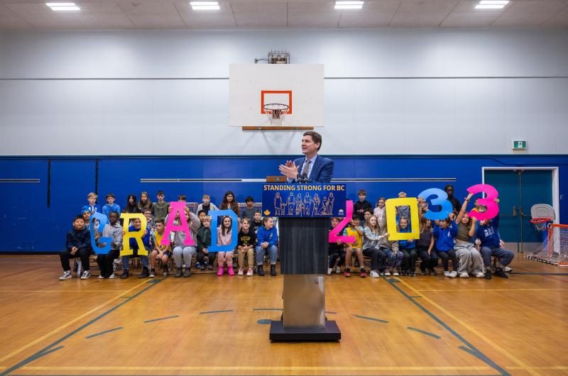 Picture of students and Premier David Eby